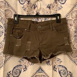 Olive green bootie shorts, distressed look.